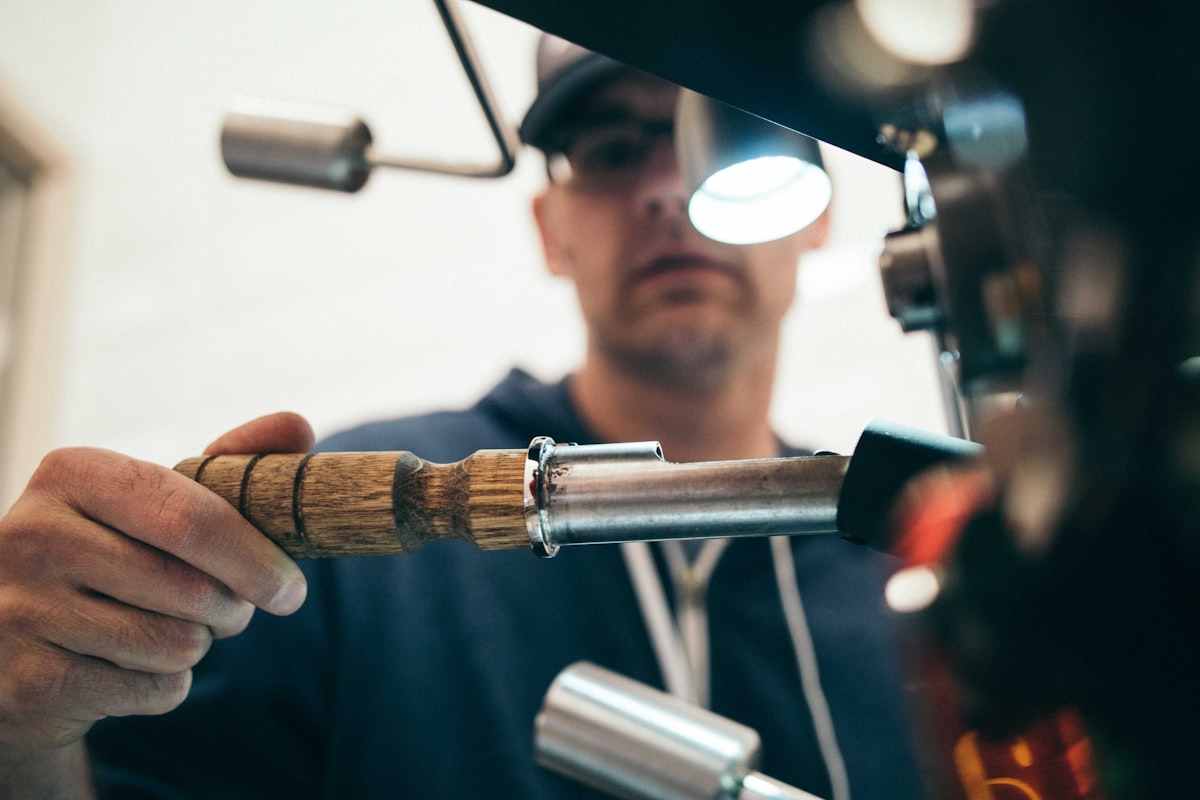 Hands on garage door hardware during a repair